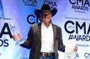 Entertainer of the Year award winner George Strait poses in the press room during the 47th Annual CMA Awards at the Bridgestone Arena on November 6, 2013 in Nashville, Tennessee
