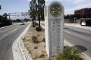 A concrete sign marks the city limits for San Bernardino, California