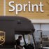 FILE - In this Thursday, July 19, 2012 file photo, a UPS truck stops in front of a Sprint store at the Derby Street Shoppes in Hingham, Mass.  Sprint Netxel Corp. is reporting their fourth quarter 2012 earnings on Thursday, Feb. 7, 2013. (AP Photo/Stephan Savoia)