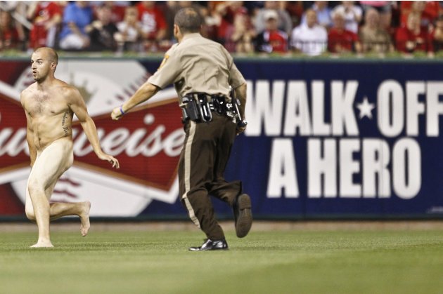 A streaker runs onto the field during the St. Louis Cardinals MLB game against Philadelphia Phillies in St. Louis