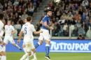 Italy's Graziano Pelle, right, scores on a header during the international friendly soccer match between Italy and England, at the Juventus stadium in Turin, Italy, Tuesday, March 31, 2015. (AP Photo/Massimo Pinca)