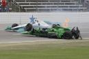 Josef Newgarden's car rolls to the upright position after being involved in a wreck with Conor Daly during an IndyCar auto race at Texas Motor Speedway, Sunday, June 12, 2016, in Fort Worth, Texas. (AP Photo/Tim Sharp)