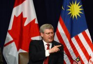 Prime Minister Stephen Harper takes part in a business round table in Kuala Lumpur, Malaysia, on Saturday, October 5, 2013. Harper will travel to the APEC Leaders' Meeting in Bali, Indonesia, following his state visit to Malaysia. THE CANADIAN PRESS/Sean Kilpatrick