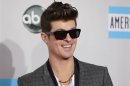 Singer Robin Thicke arrives at the 2011 American Music Awards in Los Angeles