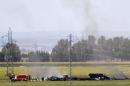 The remains of Airbus A400M are seen after crashing in a field near the Andalusian capital of Seville
