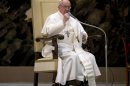Pope Francis gestures during a meeting with the media at the Pope VI hall, at the Vatican, Saturday, March 16, 2013. (AP Photo/Michael Sohn)