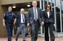 Former Michigan Supreme Court Justice Diane Hathaway, right, walks out of the Federal Building in Ann Arbor with her attorney Steve Fishman, 2nd from right, after her sentencing for bank fraud, before U.S. District Judge Corbett O'Meara, Tuesday afternoon, May 28, 2013, in Ann Arbor, Michigan. She was sentenced to a year and a day in prison. (AP Photo/Detroit News, ) DETROIT FREE PRESS OUT; HUFFINGTON POST OUT ( John T. Greilick / The Detroit News )