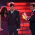 Finalists Jessica Sanchez, left, and Phillip Phillips, center, listen as host Ryan Seacrest announces the winner onstage at the "American Idol" finale on Wednesday, May 23, 2012 in Los Angeles. (Photo by John Shearer/Invision/AP)