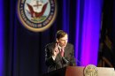 Former CIA director and retired general David Petraeus gives the sign for "fight on" as he speaks as the keynote speaker at the University of Southern California annual dinner for veterans and ROTC students, in Los Angeles