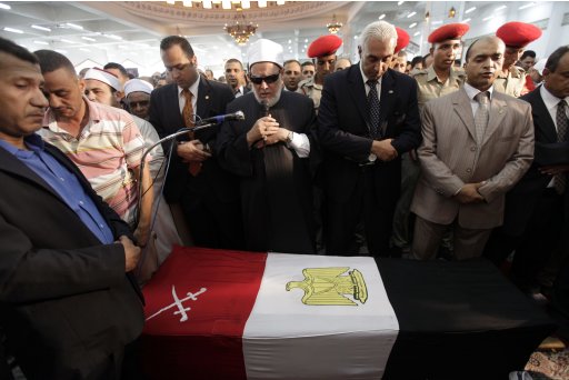 Egypt's Mufti Gomaa prays near the coffin of Egypt's former intelligence chief Suleiman during his funeral in Cairo