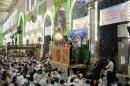 Shi'ite Muslims listen to Sheikh Abdulmehdi al-Karbalai speak during Friday prayers at the Imam Hussein shrine in Kerbala