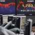 A currency dealer works in front of a screen showing the KOSPI at a dealing room of a bank in Seoul