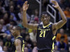 Oregon's Damyean Dotson (21) engages the crowd during the final seconds of a third-round game in the NCAA college basketball tournament against Saint Louis Saturday, March 23, 2013, in San Jose, Calif. Oregon won the game, 74-57. (AP Photo/Ben Margot)