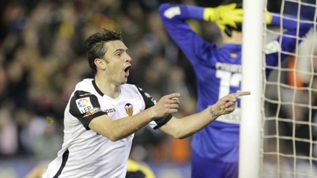 Valencia's Helder Postiga celebrates after he scored against Atletico Madrid during their Spanish King's Cup soccer match at the Mestalla stadium in Valencia, January 7, 2014 (Reuters)