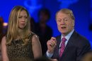 John Chambers, chairman and CEO of Cisco speaks in front of Chelsea Clinton at the Clinton Global Initiative in New York