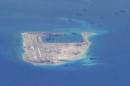 Still image from a United States Navy video purportedly shows Chinese dredging vessels in the waters around Fiery Cross Reef in the disputed Spratly Islands