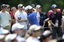 Tiger Woods watches his drive from the fourth tee during the second round of the AT&T National golf tournament at Congressional Country Club in Bethesda, Md., Friday, June 29, 2012. (AP Photo/Nick Wass)