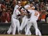 Baltimore Orioles Chris Davis, center, is picked up by teammates after driving in the game winning run against the Boston Red Sox in the 13th inning of a baseball game Thursday, June 13, 2013 in Baltimore. (AP Photo/Gail Burton)
