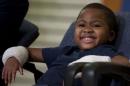 Double-hand transplant recipient eight-year-old Zion Harvey smiles during a news conference Tuesday, July 28, 2015, at The Children’s Hospital of Philadelphia (CHOP) in Philadelphia. Surgeons said Harvey of Baltimore who lost his limbs to a serious infection, has become the youngest patient to receive a double-hand transplant. (AP Photo/Matt Rourke)