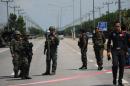 Thai security forces patrol on a highway in Thailand's restive southern province of Narathiwat
