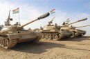 Kurdish Peshmerga troops and tanks are deployed on the outskirts of Kirkuk