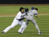 San Diego Padres' Carlos Quentin charges into Los Angeles Dodgers  pitcher Zack Greinke after being hit by a pitch in the sixth inning of baseball game in San Diego, Thursday, April 11, 2013. (AP Photo/Lenny Ignelzi)