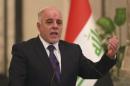 Iraq's Prime Minister-designate Haider al-Abadi gestures during a news conference in Baghdad