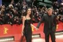 Cast member Clooney and his wife Amal arrive on red carpet for screening at opening gala of 66th Berlinale International Film Festival in Berlin