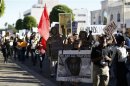 Demonstrators march to protest the acquittal of George Zimmerman in the killing of Florida teen Trayvon Martin in Beverly Hills