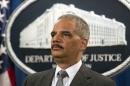 U.S. Attorney General Eric Holder stands during a news conference after BNP Paribas pleaded guilty, in Washington