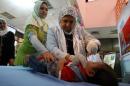 Iraqi nurses administer polio vaccinations on October 4, 2011 to children in Baghdad