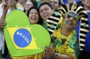 Fans of Brazil smile before the team's Confederations Cup final soccer match against Spain at the Estadio Maracana in Rio de Janeiro