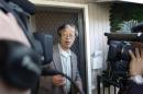 A man widely believed to be Bitcoin currency founder Satoshi Nakamoto is surrounded by reporters as he leaves his home in Temple City, California