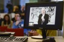 WikiLeaks founder Assange, speaking during a teleconference from Ecuador's embassy in central London, is pictured on a screen during a news conference in Brussels