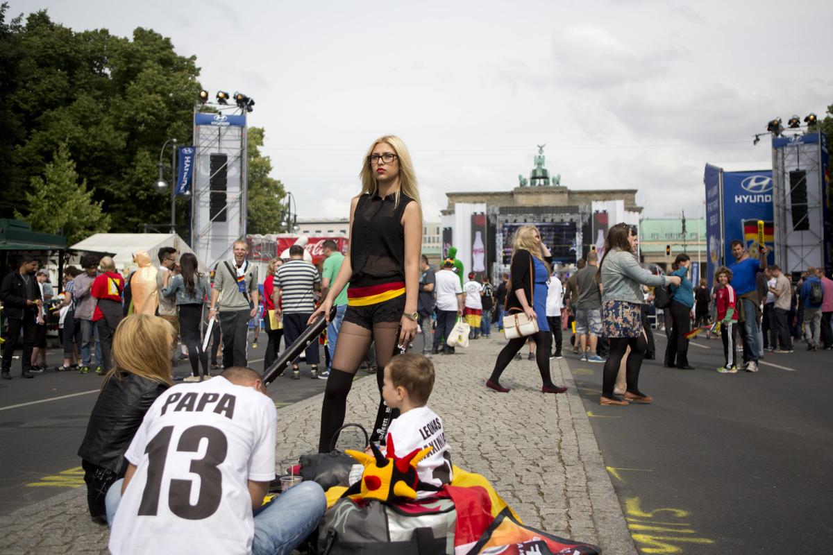 German soccer fans wait for screening of the 2014 World Cup soccer match between Germany and Portugal in Berlin