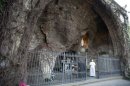 Pope Francis I prays before the replica of the Grotto of Lourdes at the Vatican Gardens in the Vatican
