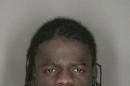 Murder suspect Wint is pictured in police booking photograph