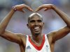 Britain's Mohamed Farah celebrates after winning the men's 5000m