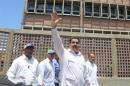 Venezuela's President Nicolas Maduro greets supporters as he arrives to an inauguration of a new school in La Guaira