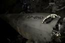 The wreckage of a plane is seen as Pakistani army and emergency services begin rescue operation at a remote crash site where a plane carrying 47 people crashed into a northern Pakistan mountain, in this still frame taken from video