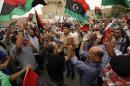 Libyans celebrate after the Supreme Court invalidated the country's parliament, at Martyrs' Square in Tripoli