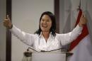 Presidential candidate Keiko Fujimori gives the thumbs up during a news conference, in Lima, Peru, Sunday, April 10, 2016. Exit polls pointed to Keiko, the daughter of jailed former President Alberto Fujimori emerging with the most votes, though not the simple majority needed to avoid a runoff election. (AP Photo/Martin Mejia)