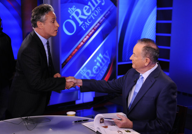 FILE - In this Sept. 22, 2010 file photo, Comedy Central's Jon Stewart, left, and Bill O'Reilly tape an interview in New York. Stewart and O'Reilly, a celebrity odd couple with a history of public political feuds, tangle in a sold-out debate in Washington. The so-called "Rumble in the Air-Conditioned Auditorium" offers a jocular sideshow to the series of three more somber debates this month between President Barack Obama and Republican Mitt Romney. (AP Photo/Peter Kramer)