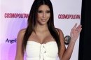 Socialite and reality TV star Kim Kardashian waves to the media as she arrives to attend an event celebrating the 40th anniversary of Cosmopolitan magazine at a hotel in Mexico City