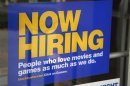 A help wanted sign hangs on the door of a Blockbuster movie and game store in Golden