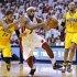 Miami Heat's James drives through Indiana Pacers' defense during their NBA Eastern Conference final basketball playoff in Miami
