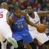 Oklahoma City Thunder's Kevin Durant is fouled by Los Angeles Clippers Caron Butler as the Clippers DeAndre Jordan looks on during their NBA basketball game in Los Angeles