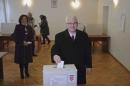 Croatian President Ivo Josipovic casts his vote at a polling booth during the presidential election in Zagreb