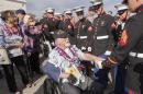 Pearl Harbor survivor Donald Barnhart, center, shakes the hand of a United States Marine while leaving the 75th Anniversary National Pearl Harbor Remembrance Day Commemoration on Kilo Pier at Joint Base Pearl Harbor-Hickam, Wednesday, Dec. 7, 2016, in Honolulu. Survivors of the Japanese attack, dignitaries and ordinary citizens attended the ceremony. (AP Photo/Eugene Tanner)