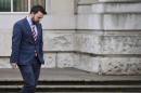 Colm Eastwood of the Social Democratic and Labour Party departs the High Court in Belfast